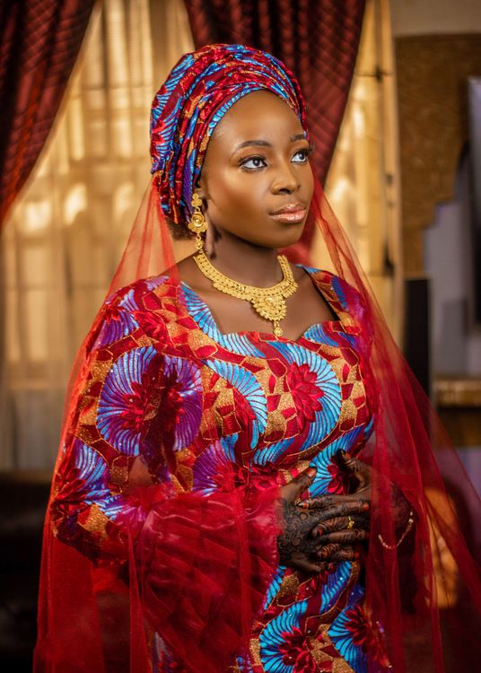 Elegant Woman in Vibrant Traditional Attire Indoors · Free Stock Photo