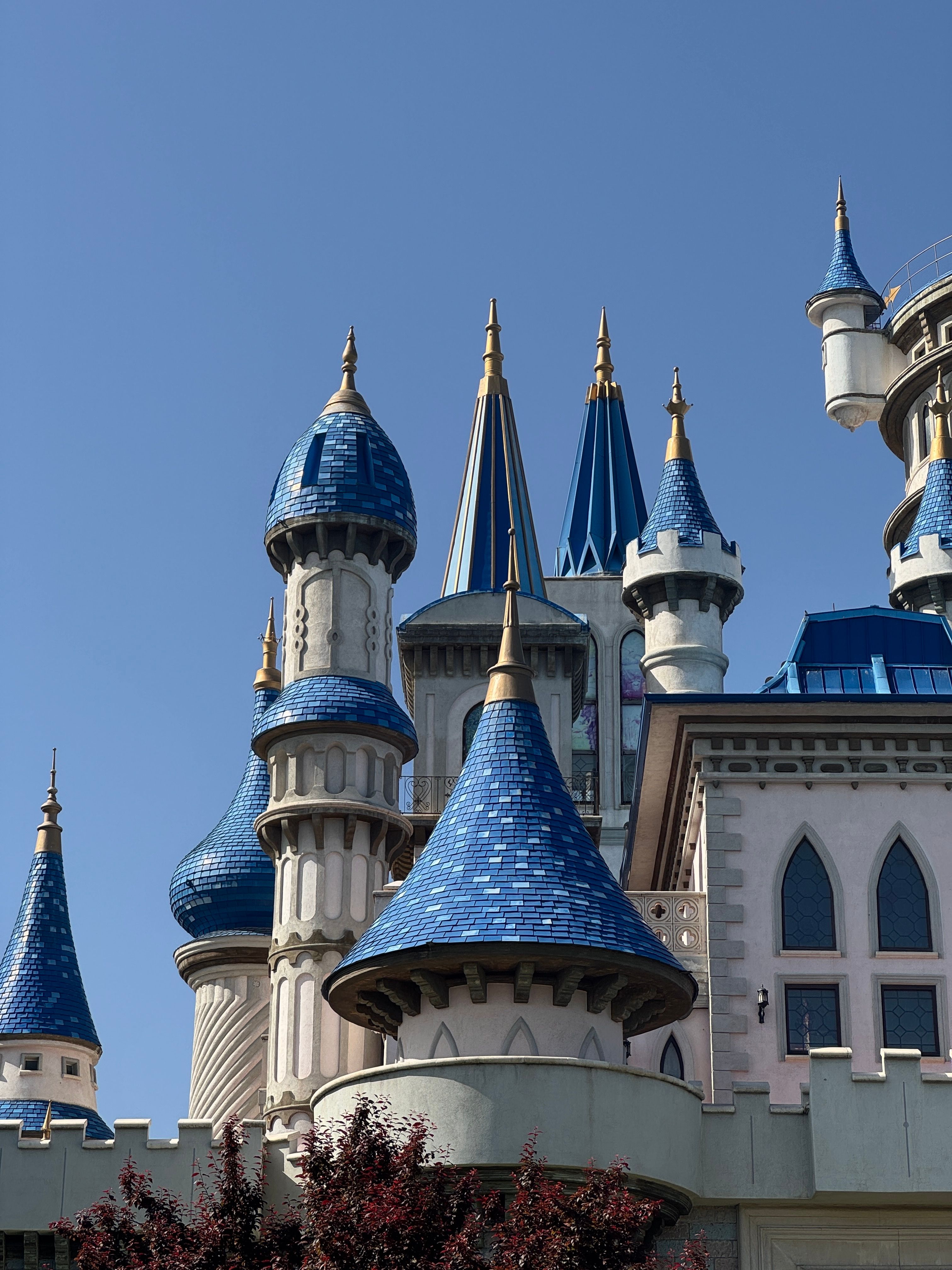 Fairytale Castle with Blue Spires Under Clear Sky · Free Stock Photo