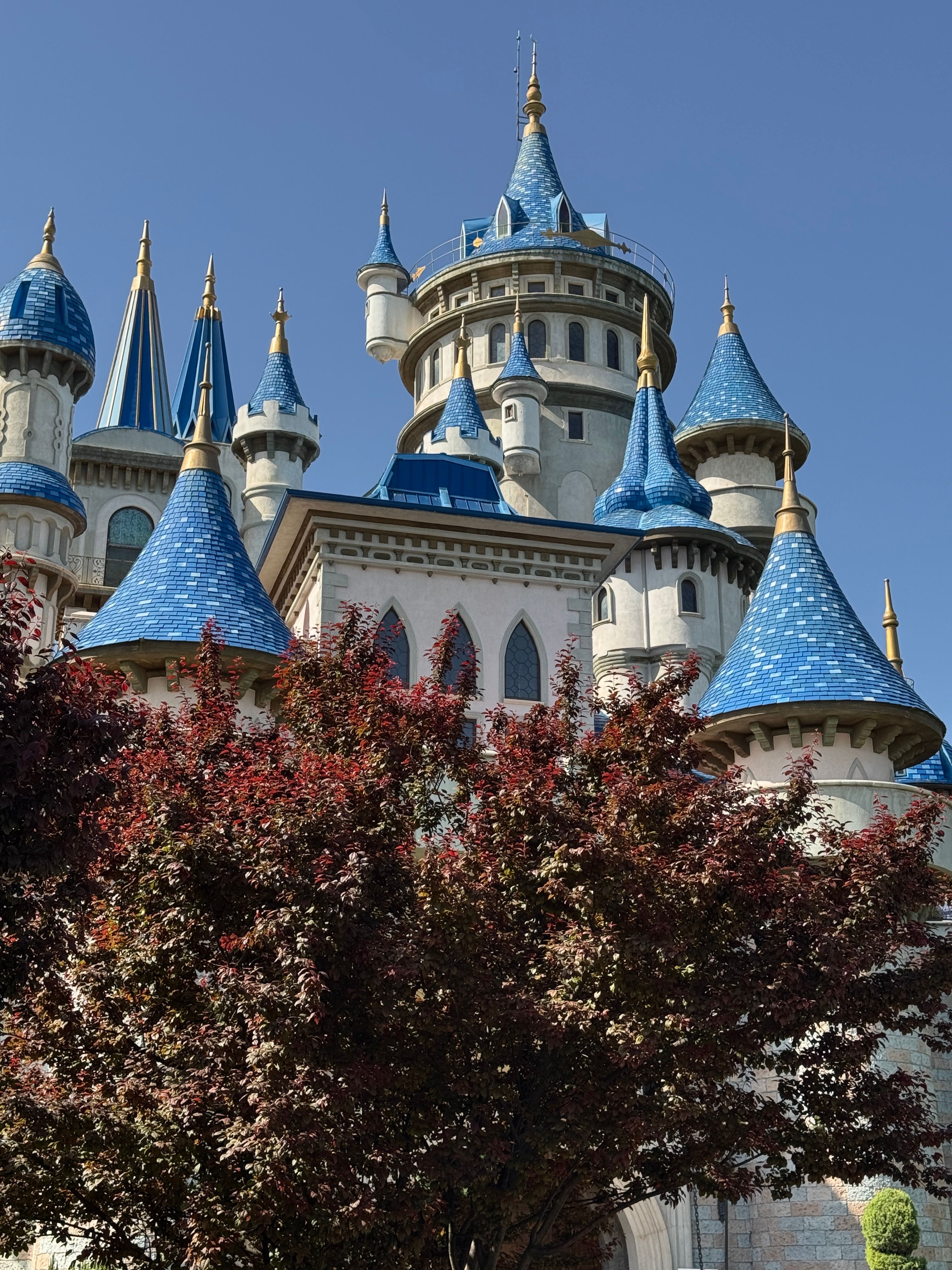 Fairytale Castle with Blue Spires Under Clear Sky · Free Stock Photo