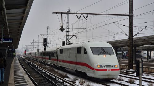 Free ICE train at a German station during a cloudy winter day, showcasing modern rail travel. Stock Photo
