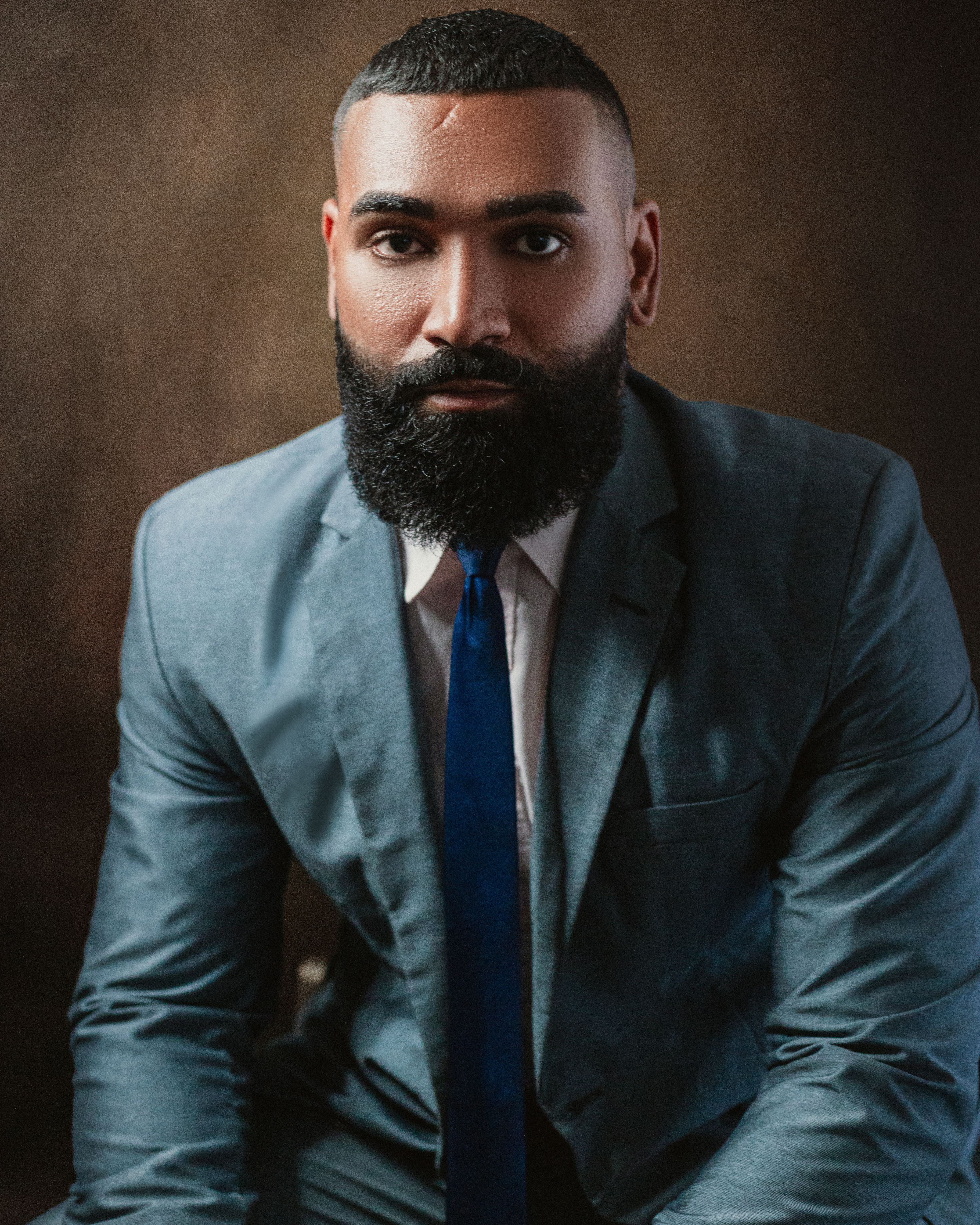 Professional Portrait of a Bearded Man in a Suit · Free Stock Photo