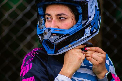 Female Mx Racers Female motocross racer in full gear resting · Free Stock Photo