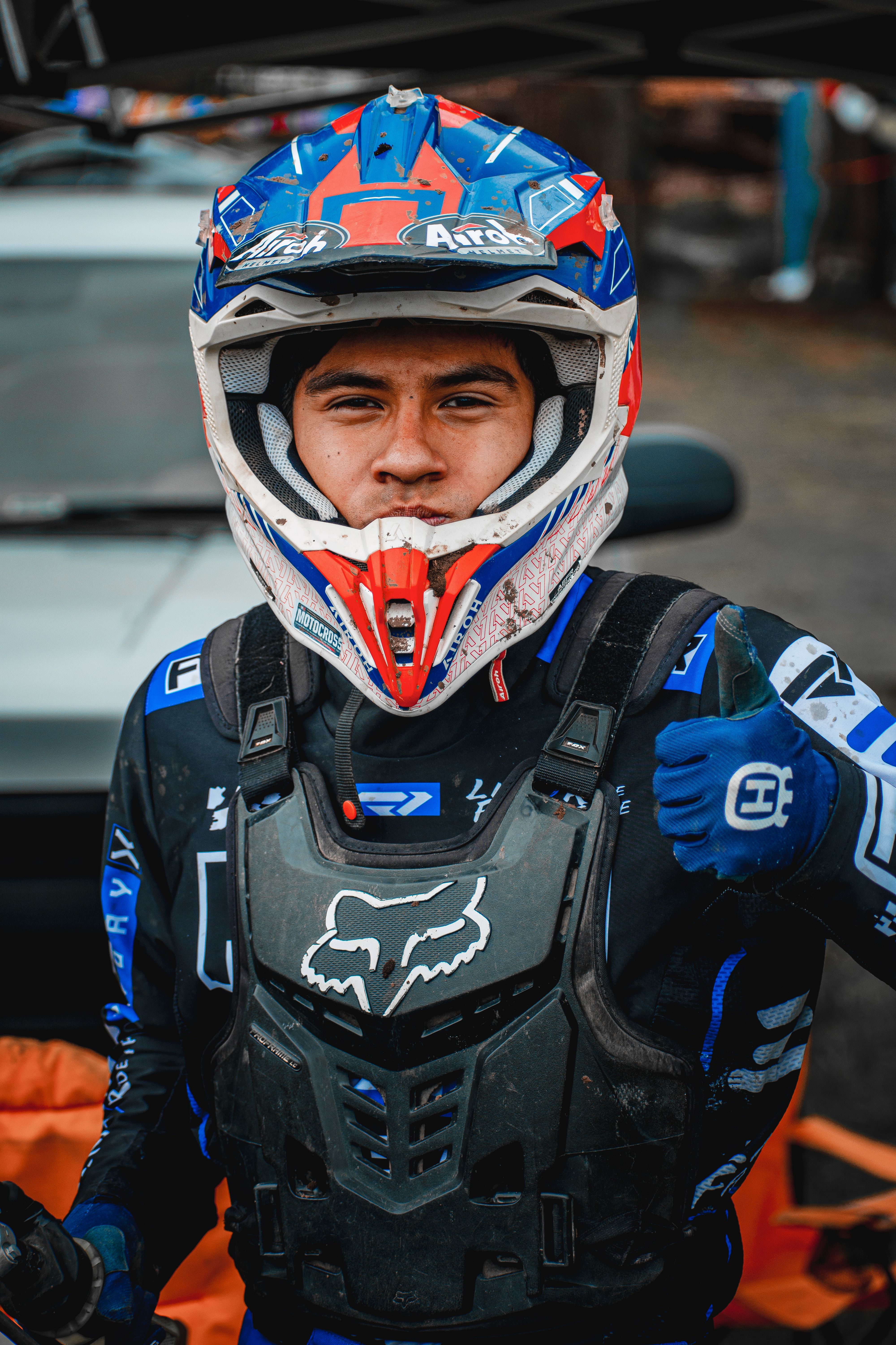 Motocross rider giving thumbs up in La Marquesa, Mexico, wearing a helmet and gear.