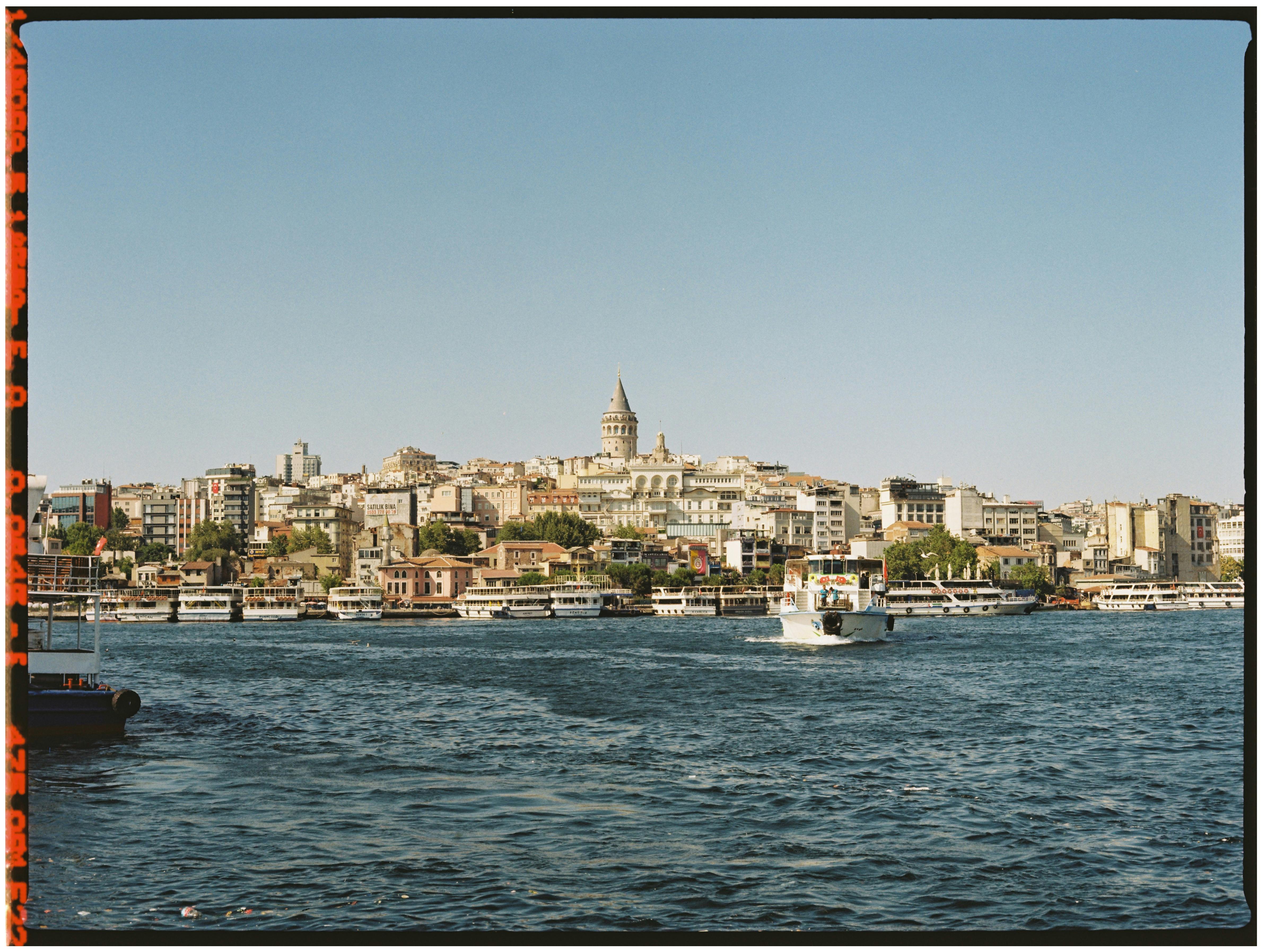 Scenic view of Istanbul's Galata Tower and city skyline from the waterfront.