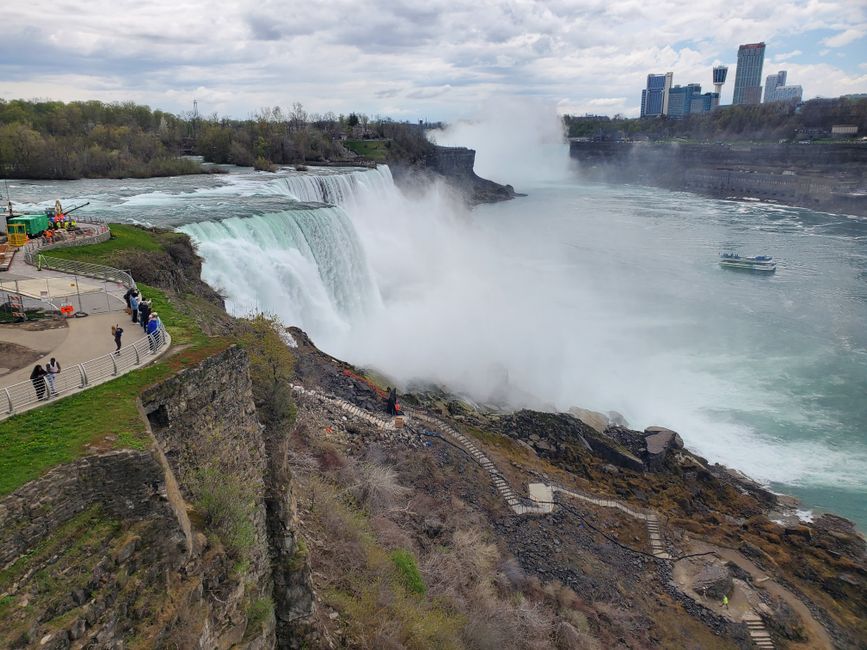 Niagara Falls USA Premium Tour: Helicopter & Maid of the Mist - Breathtaking aerial view of Niagara Falls with mist rising and tourists observing from the side.