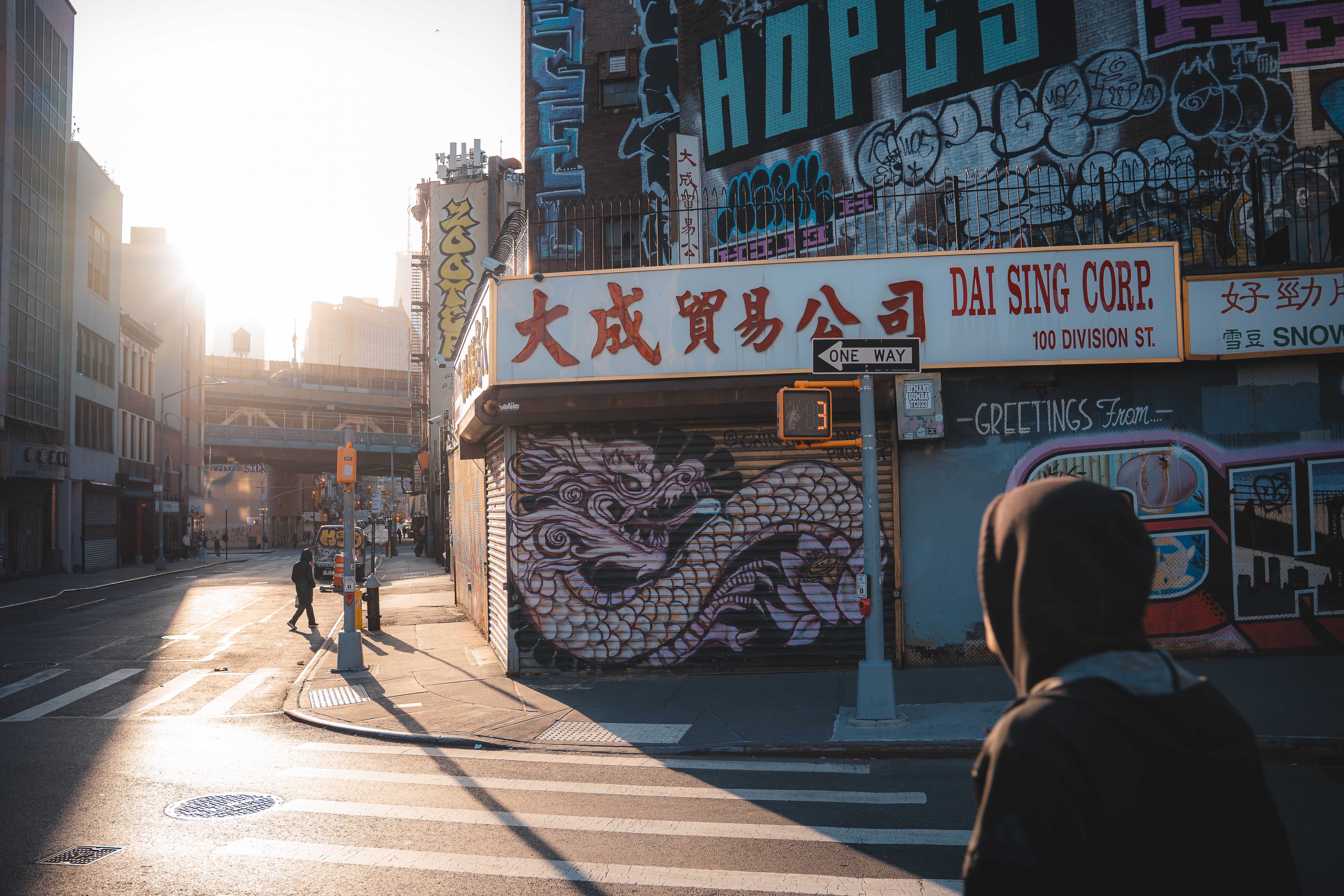 A vibrant street scene in New York City featuring urban graffiti and morning light.