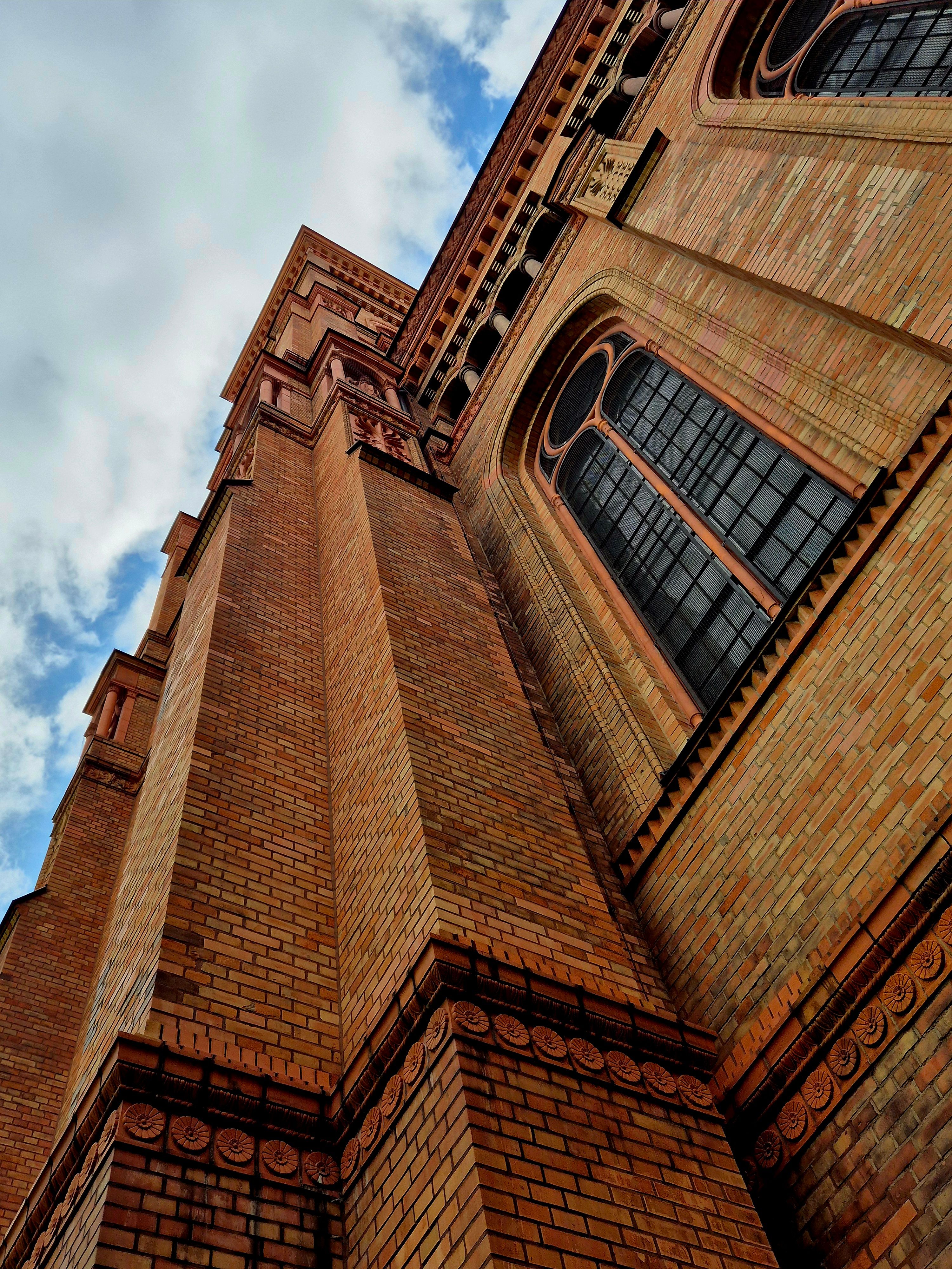 Majestic Gothic Brick Architecture View · Free Stock Photo