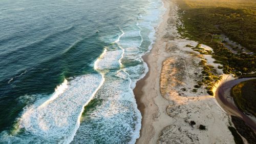 Free Stunning aerial view of Lake Munmorah's beach and ocean waves in New South Wales, Australia. Stock Photo