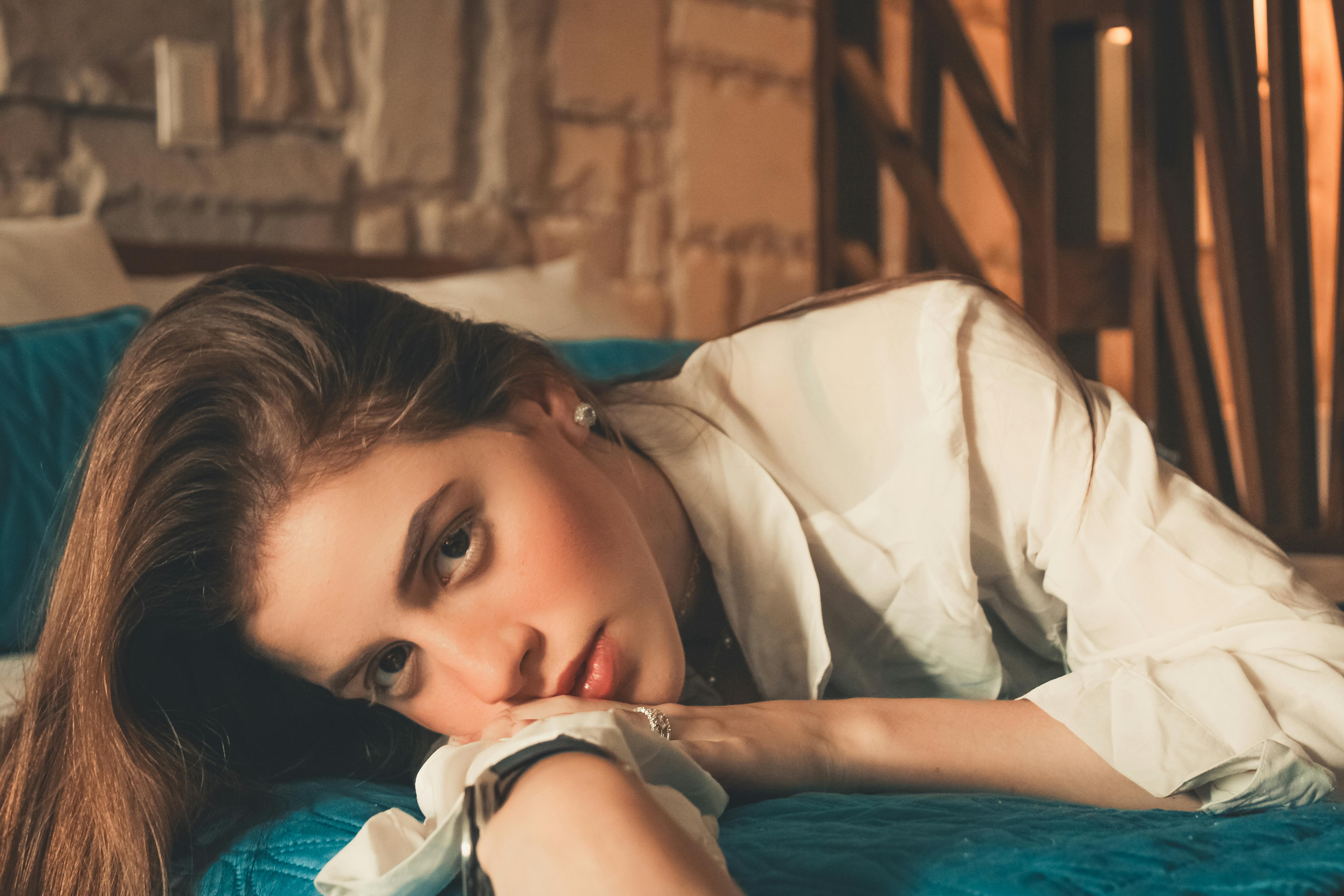 Seductive woman lying on bed · Free Stock Photo