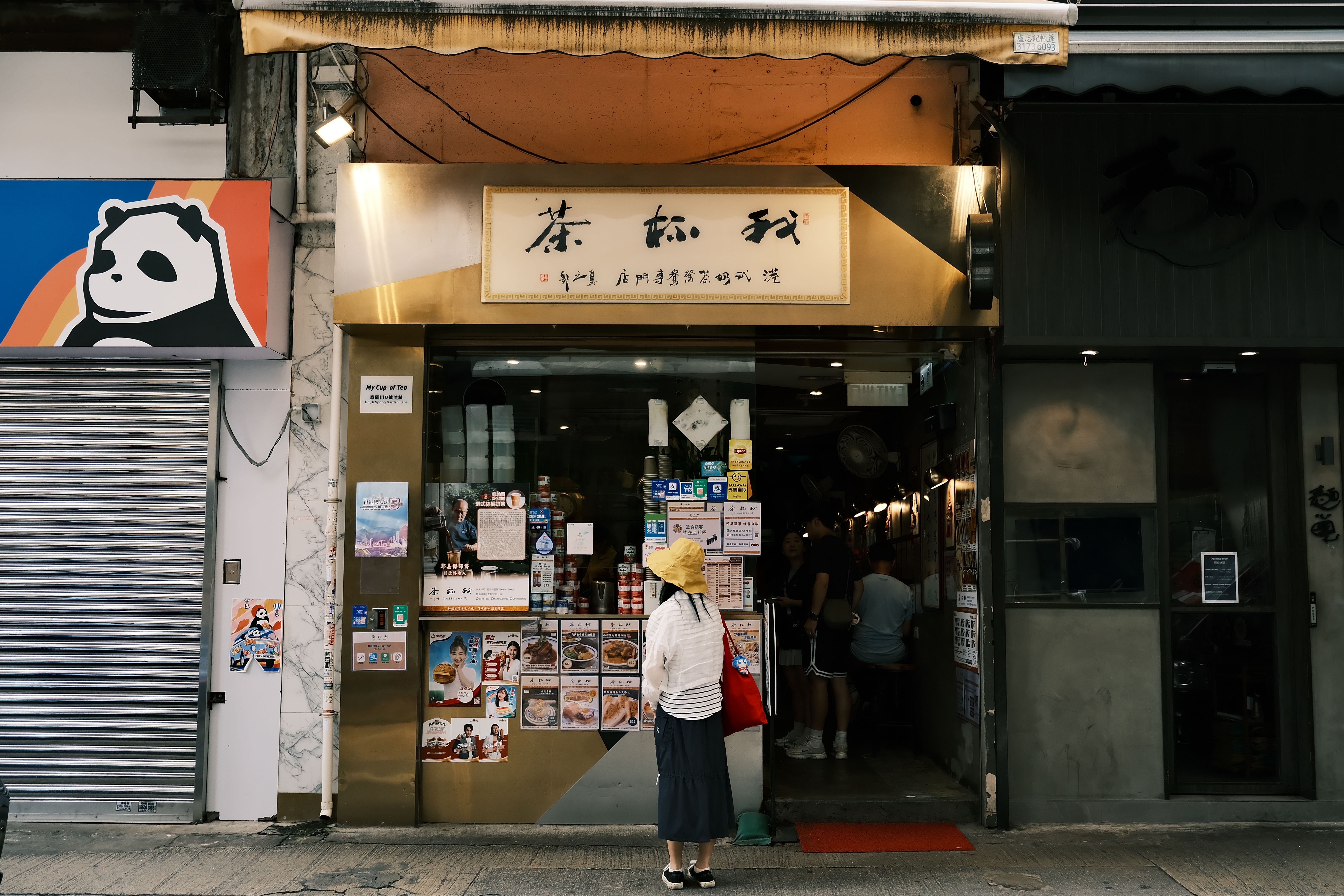 Street View of Asian Tea Shopfront with Pedestrian · Free Stock Photo