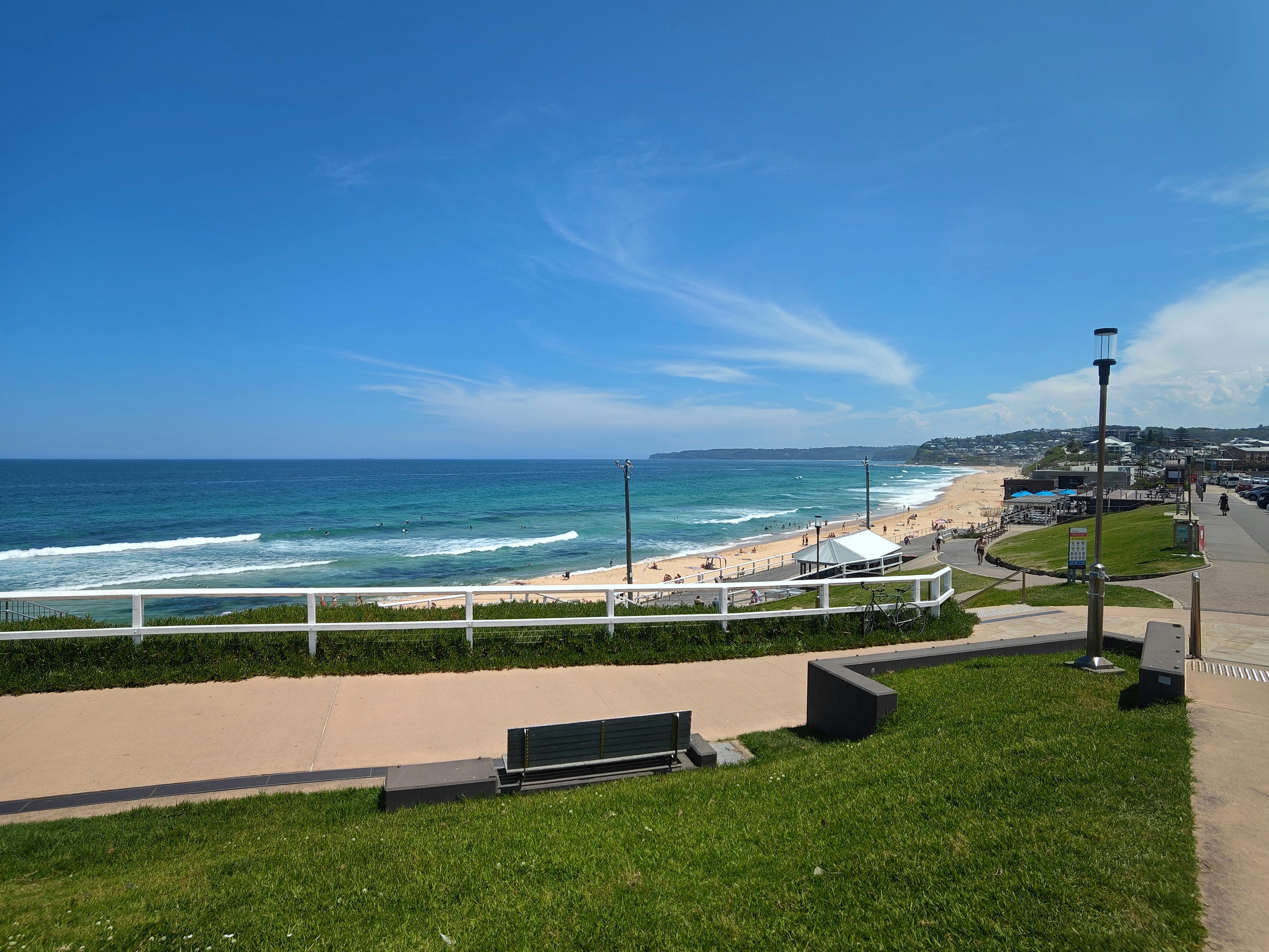 Bright and sunny day at Merewether Beach, showcasing the Australian coastline and vibrant ocean.