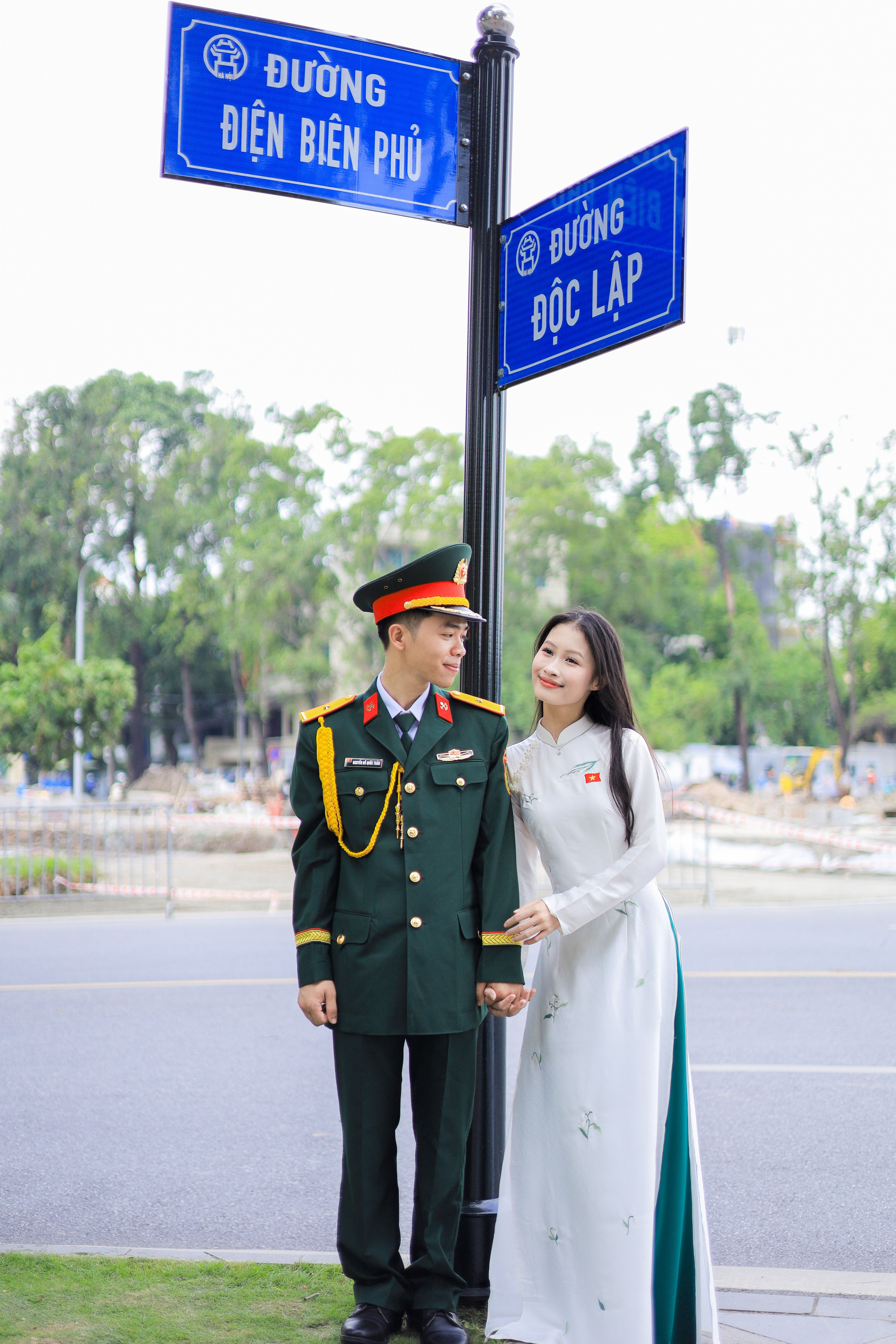 Vietnamese Couple In Traditional And Military Attire Free Stock Photo