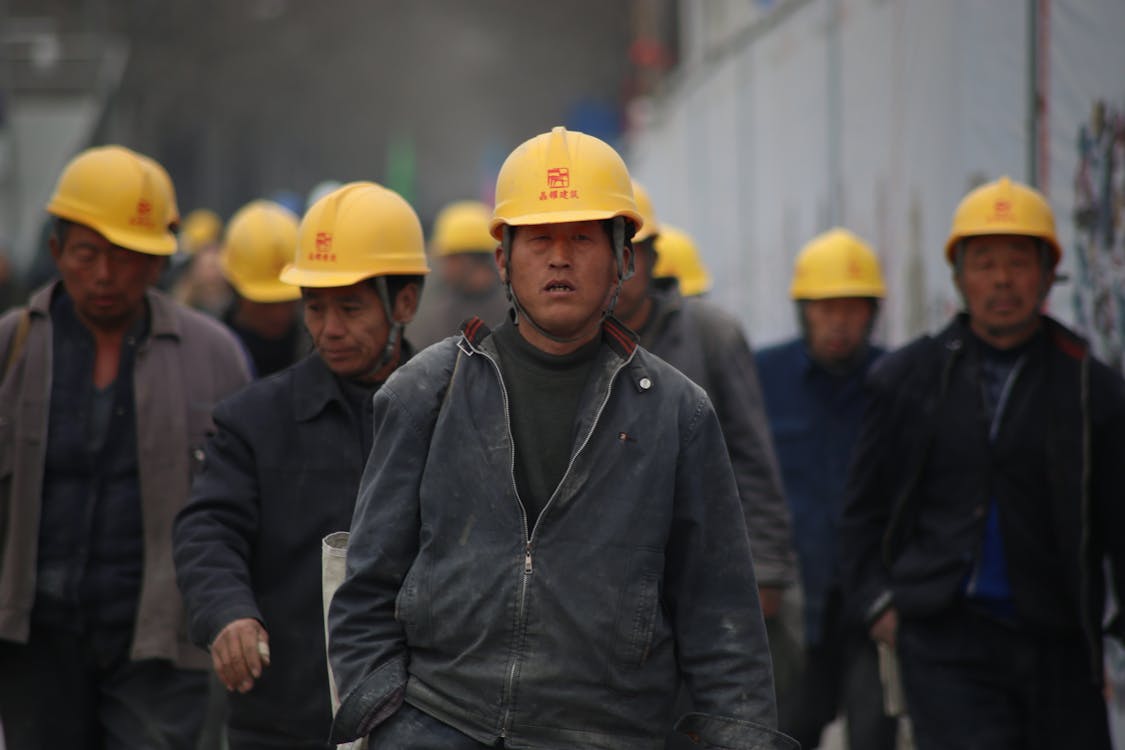 Free Group of Persons Wearing Yellow Safety Helmet during Daytime Stock Photo