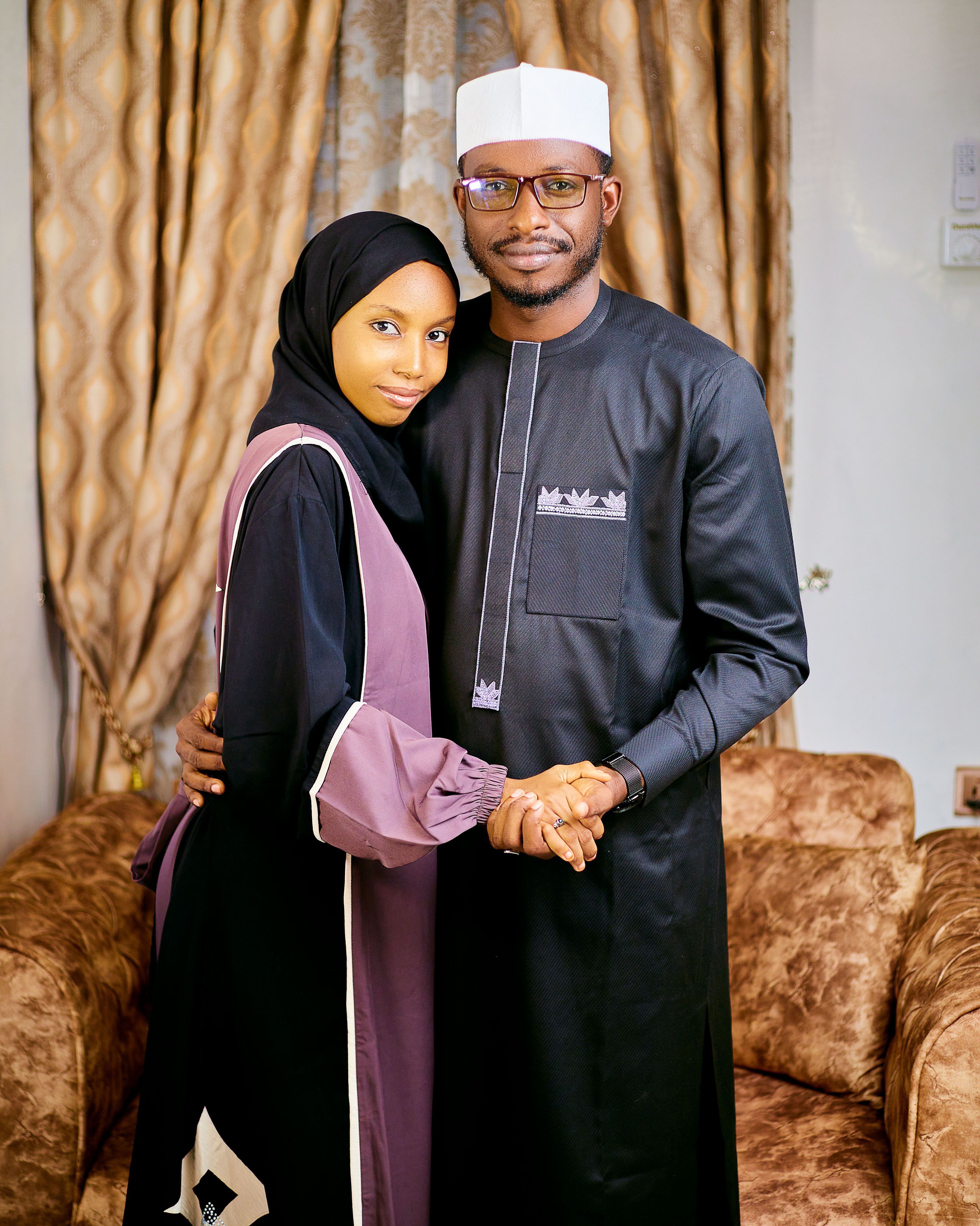 Elegant Couple Embracing in Traditional Attire · Free Stock Photo
