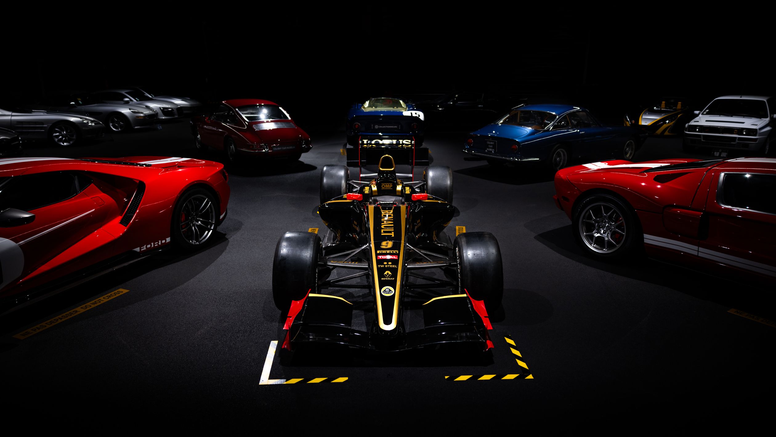 High-Performance Racing Cars in Showroom Display ยท Free Stock Photo