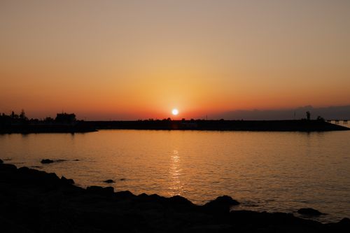 Free Calm waters and vibrant sunset over the harbor in Pazar, Rize, Türkiye. Stock Photo
