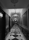 Elegant Black and White Hotel Corridor with Geometric Design