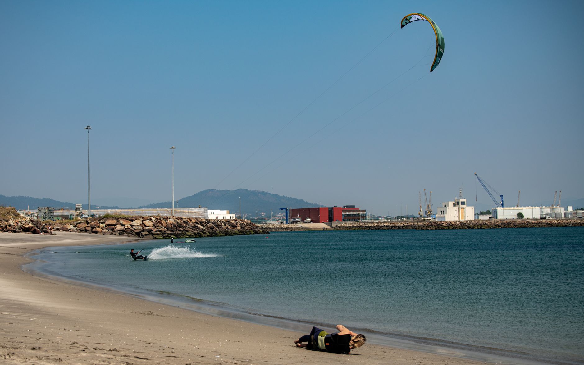 Dynamic kitesurfing scene at Viana do Castelo beach, Portugal, highlighting adventure and tranquility.