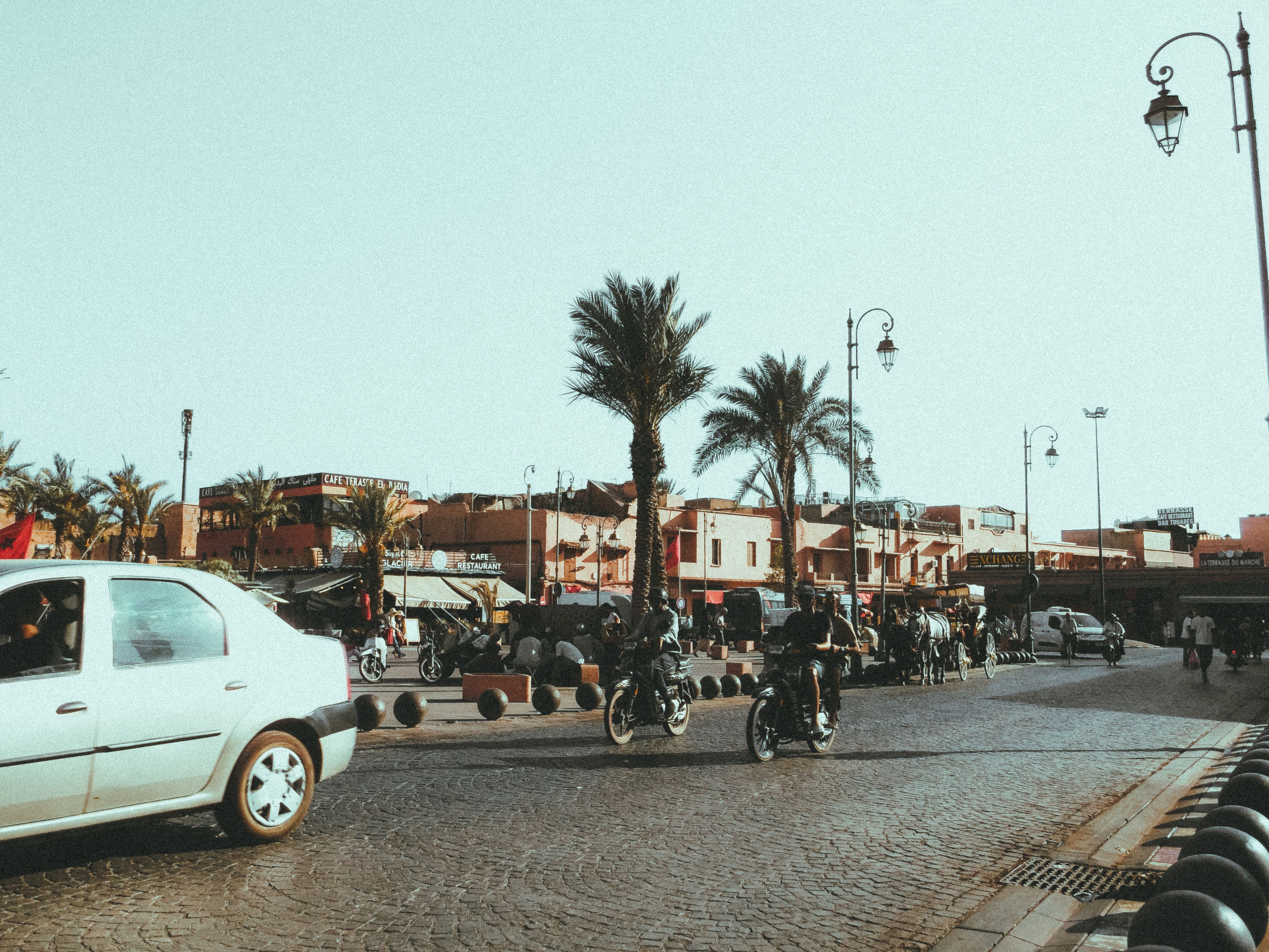 A petit taxi in Marrakech, Morocco, driving through a city street, representing local transportation