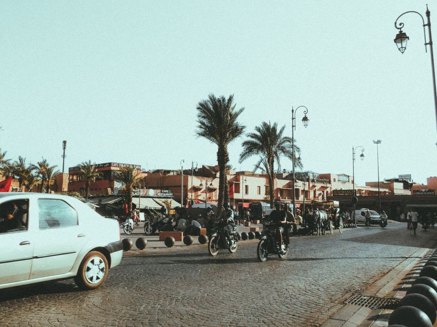 A petit taxi in Marrakech, Morocco, driving through a city street, representing local transportation