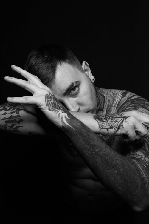 Grayscale Photography of Topless Man With Body Tattoo