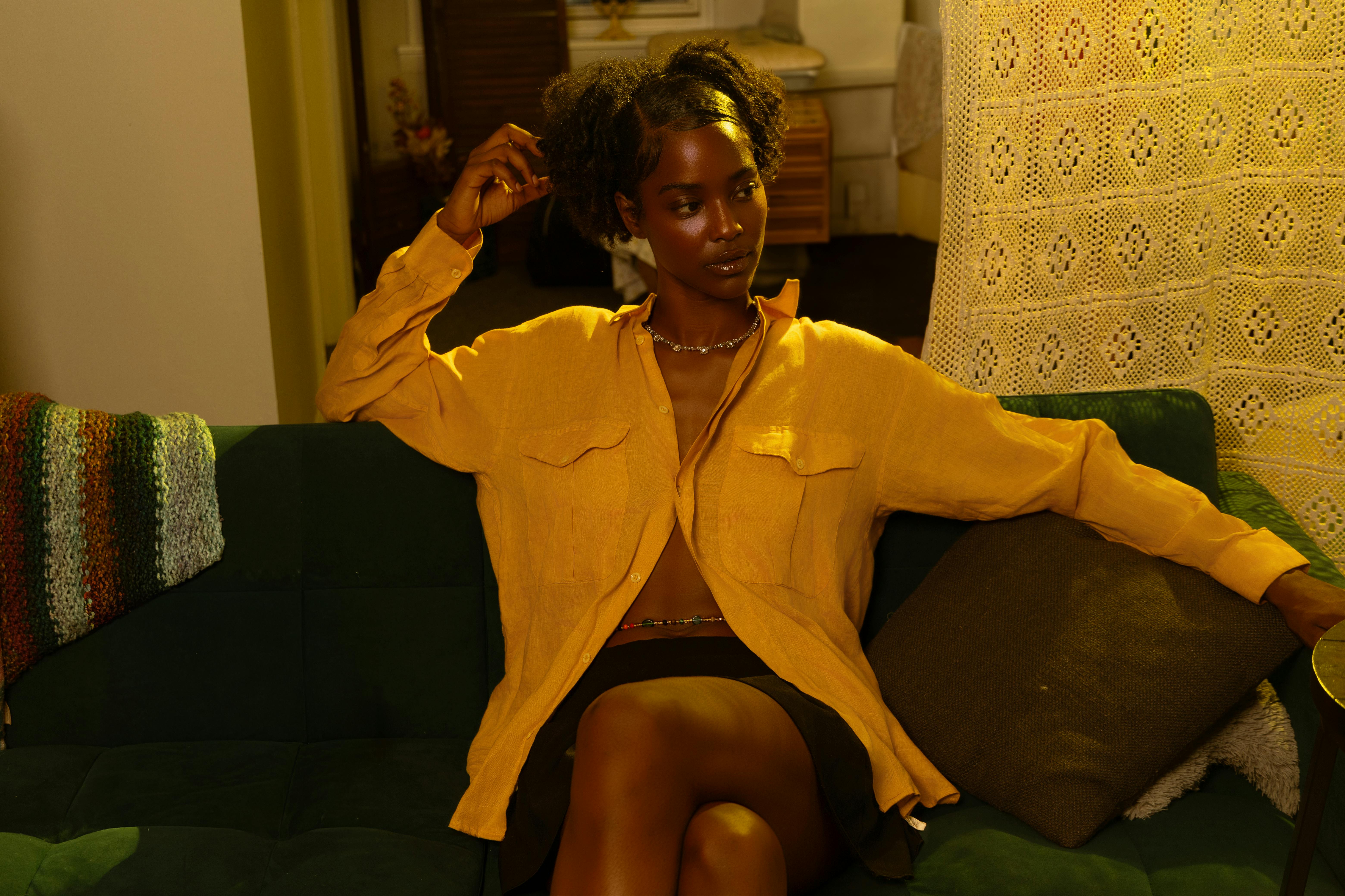 woman meditating in a chic living room