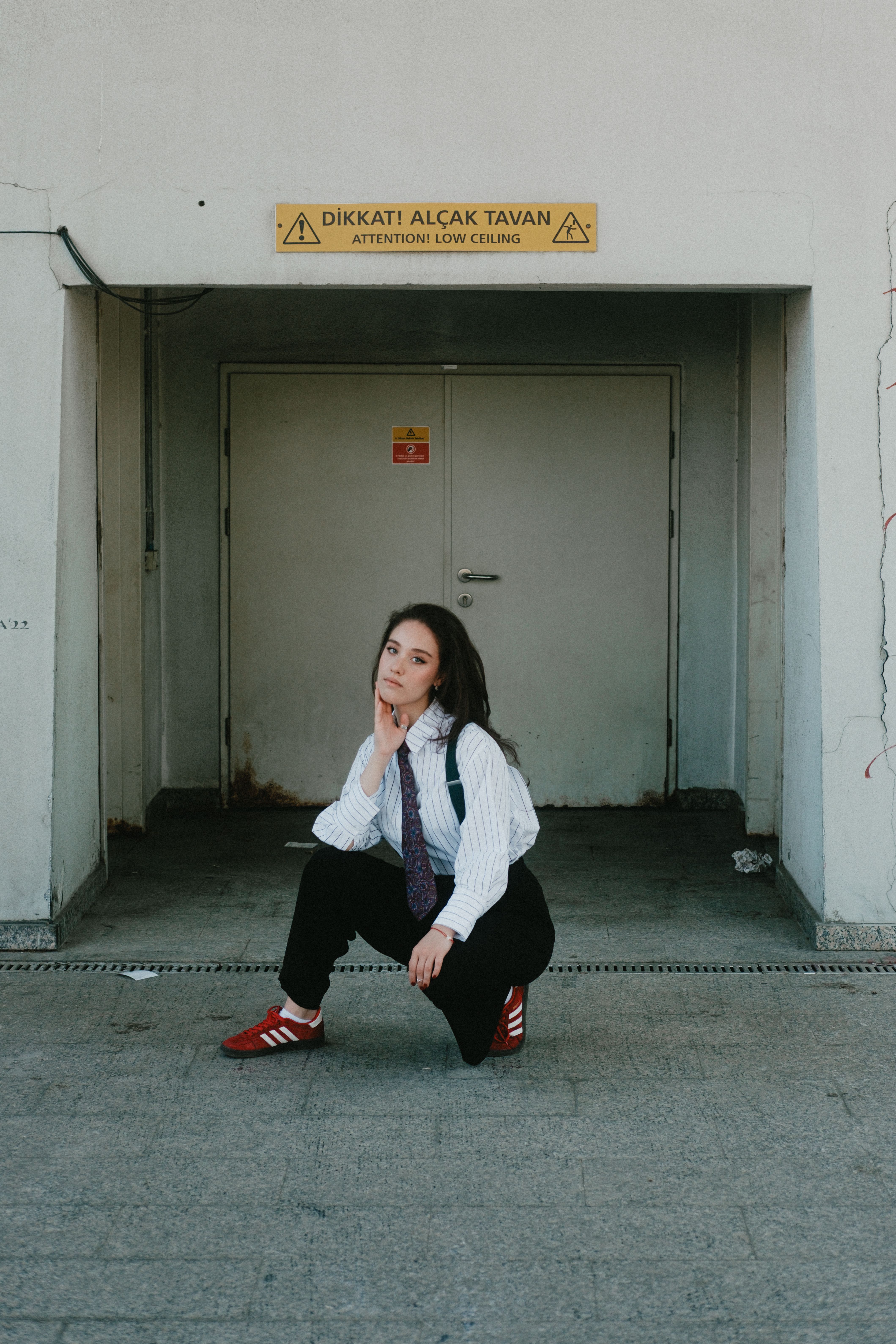 Confident Woman Posing in Urban Setting · Free Stock Photo
