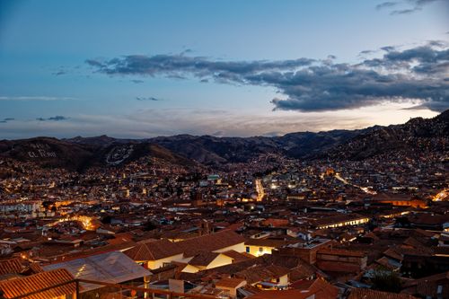 Free A scenic twilight view of the historical city of Cusco with mountains in the backdrop. Stock Photo