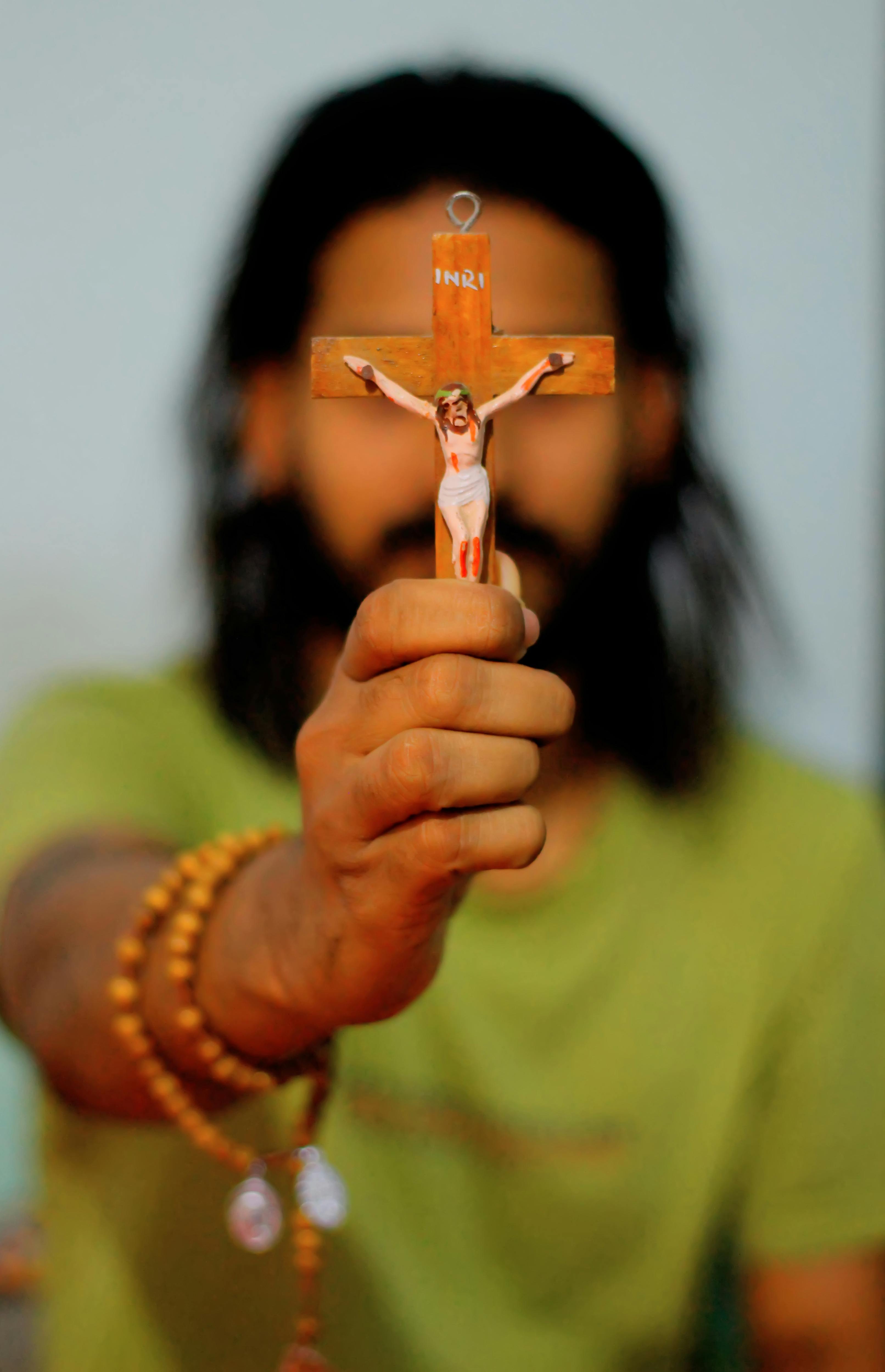 Man Holding Crucifix · Free Stock Photo