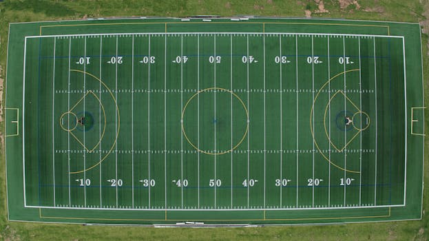Aerial view of a multi-sport field featuring football and soccer markings.