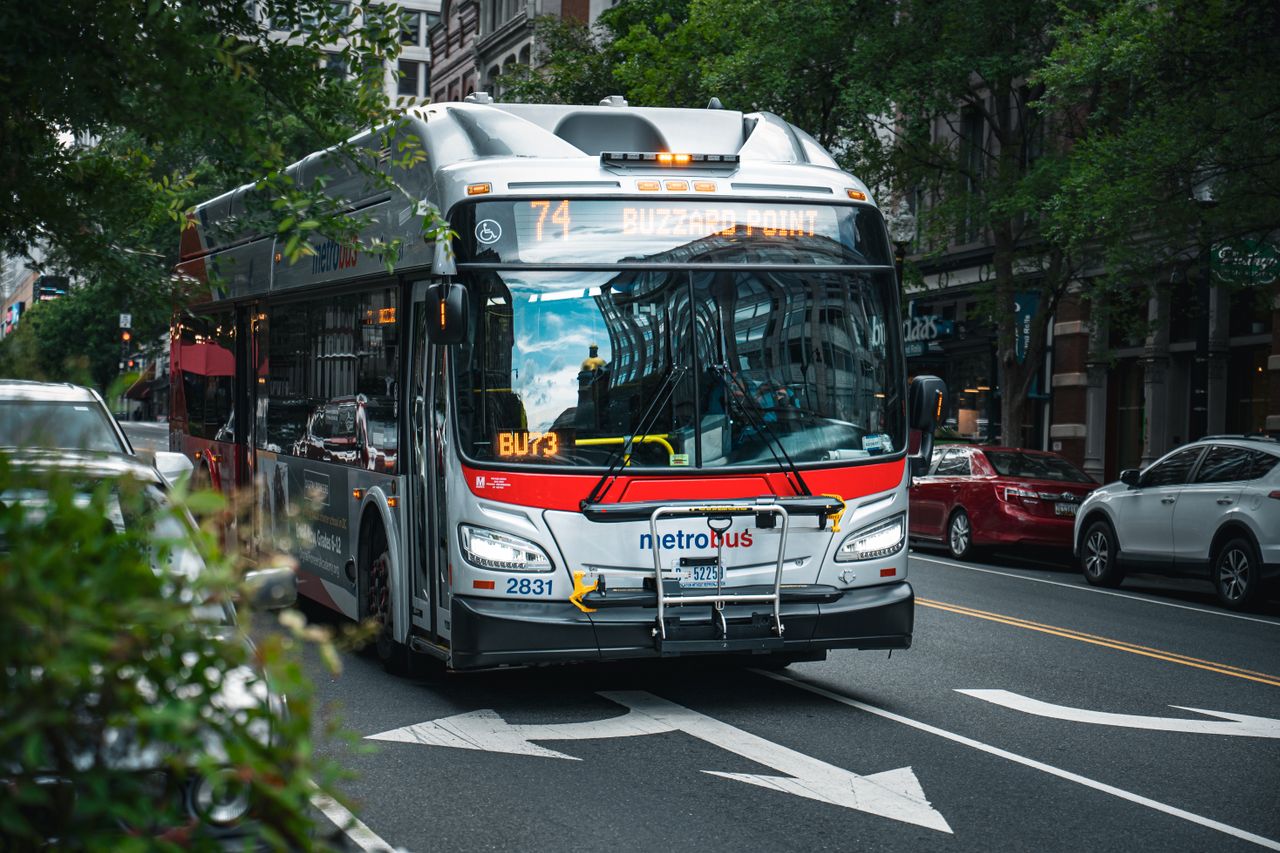 a metro bus drives through washington dc showcasing urban city life an