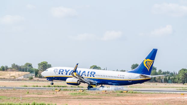 Ryanair airplane touching down at Manises Airport, Spain, capturing a smooth landing moment.