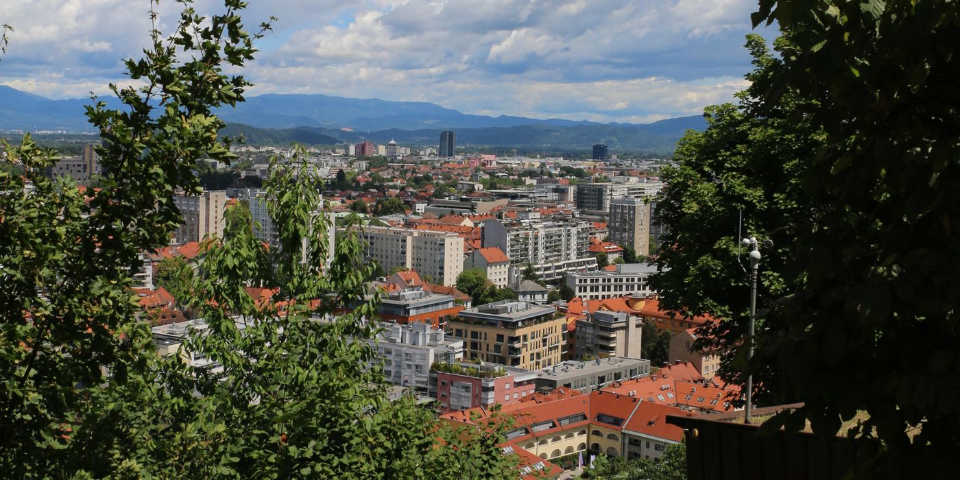 Panoramic view of Ljubljana cityscape with castle on hill and the Ljubljanica river