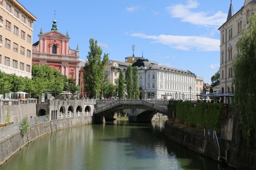 Free Scenic view of the Franciscan Church and Triple Bridge over the Ljubljanica River in Ljubljana, Slovenia. Stock Photo