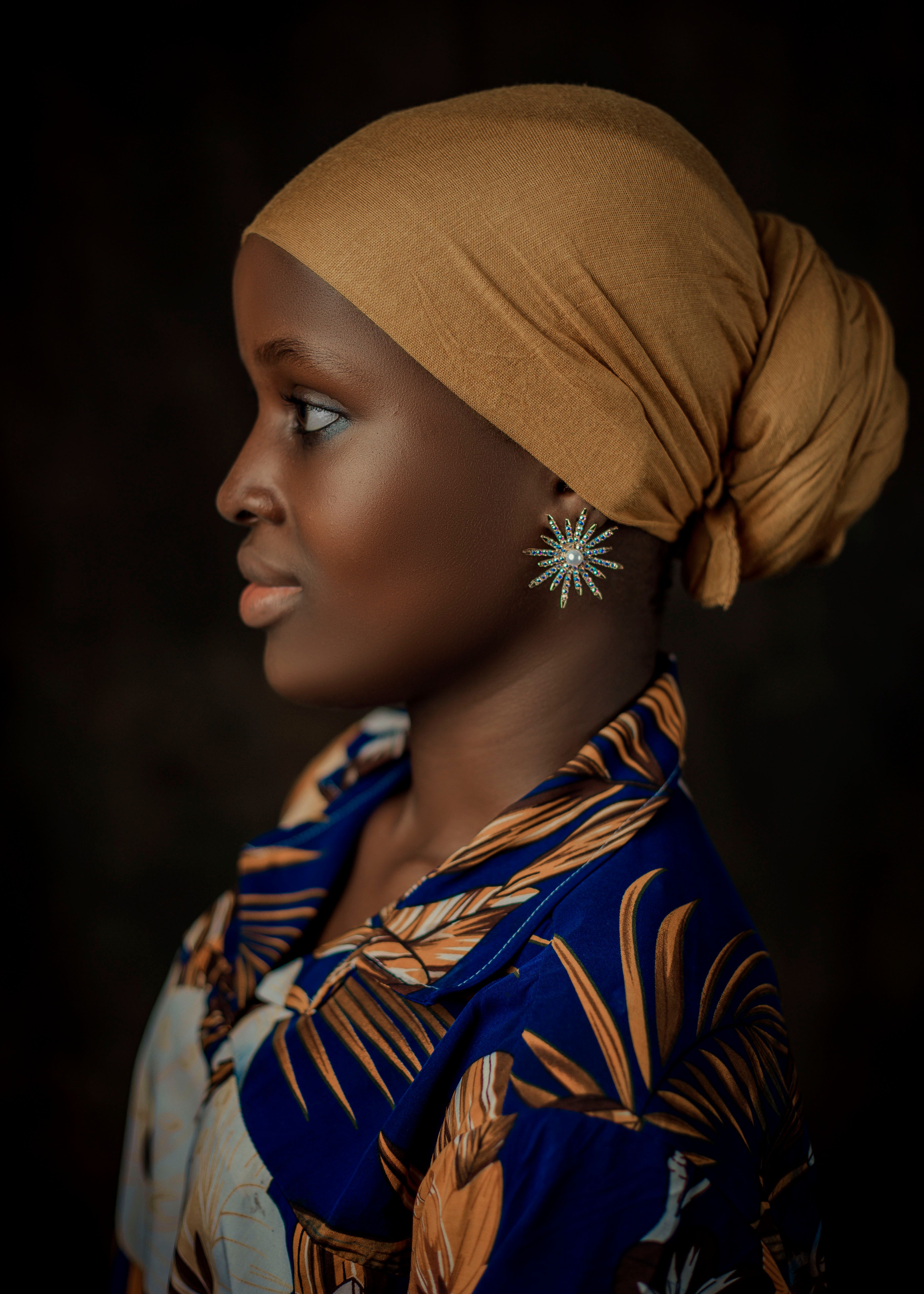 Elegant Portrait of a Woman Wearing a Headscarf · Free Stock Photo