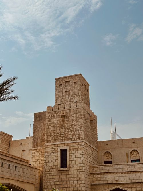 Free Majestic stone fortress reflecting traditional Middle Eastern architecture under a clear blue sky. Stock Photo