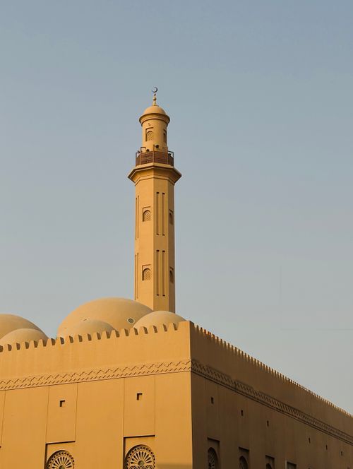 Free A beautifully designed mosque minaret captured against a clear blue sky, highlighting Islamic architecture. Stock Photo
