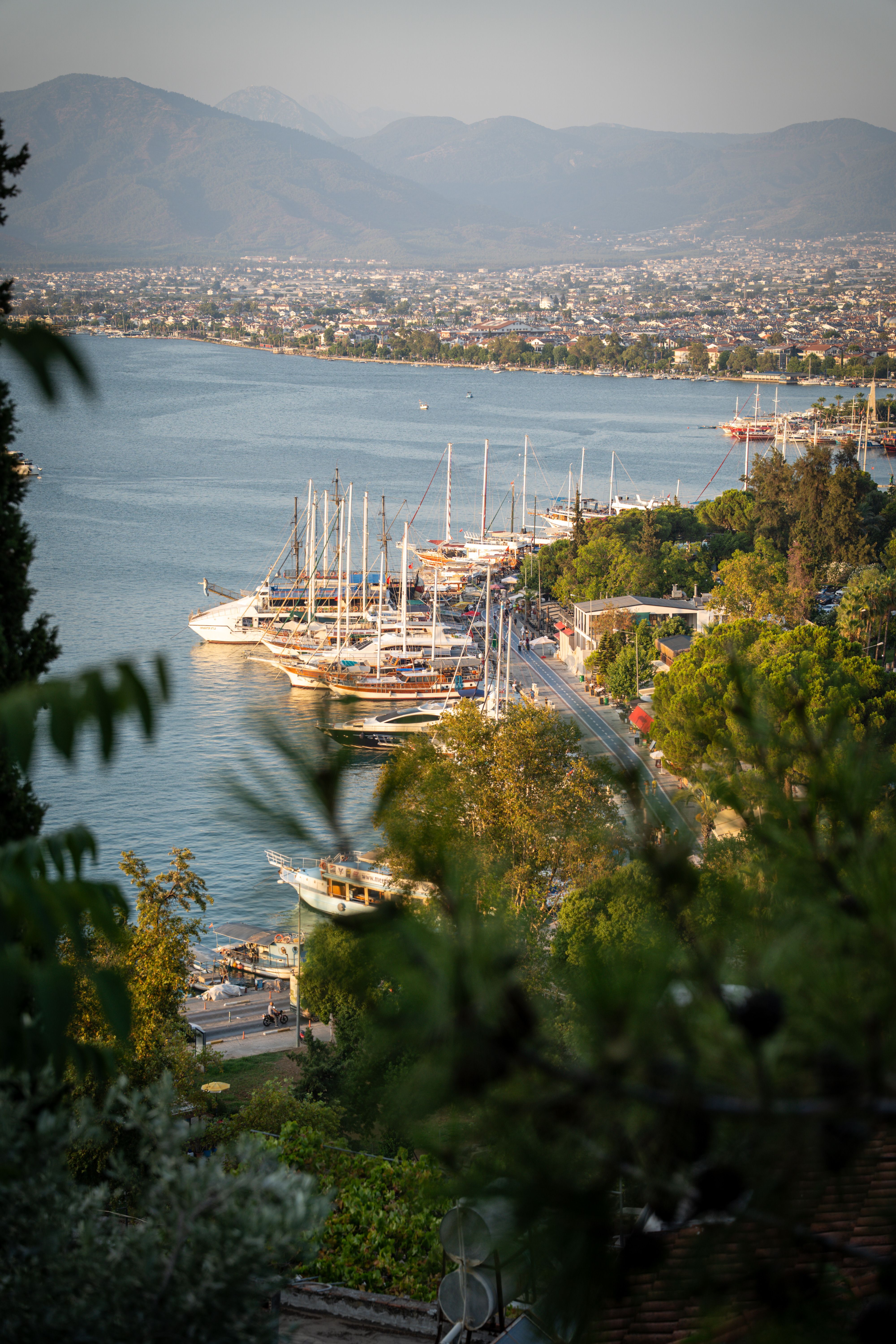 Scenic Aerial View of Coastal City Harbor at Sunset · Free Stock Photo