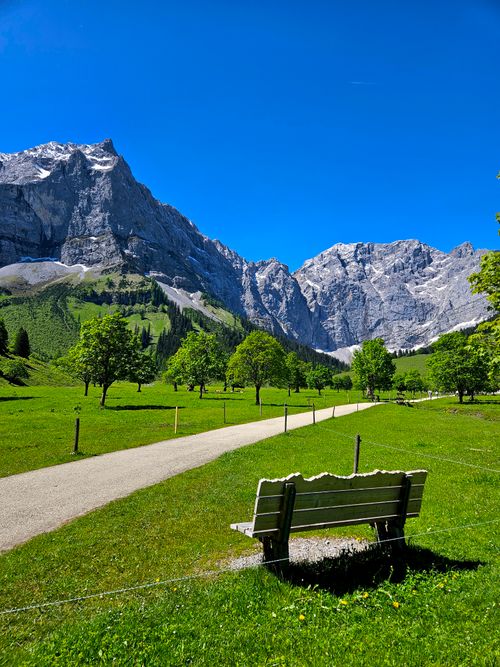 Free Tranquil mountain scene with a bench and path in Hinterriß, Austria. Stock Photo