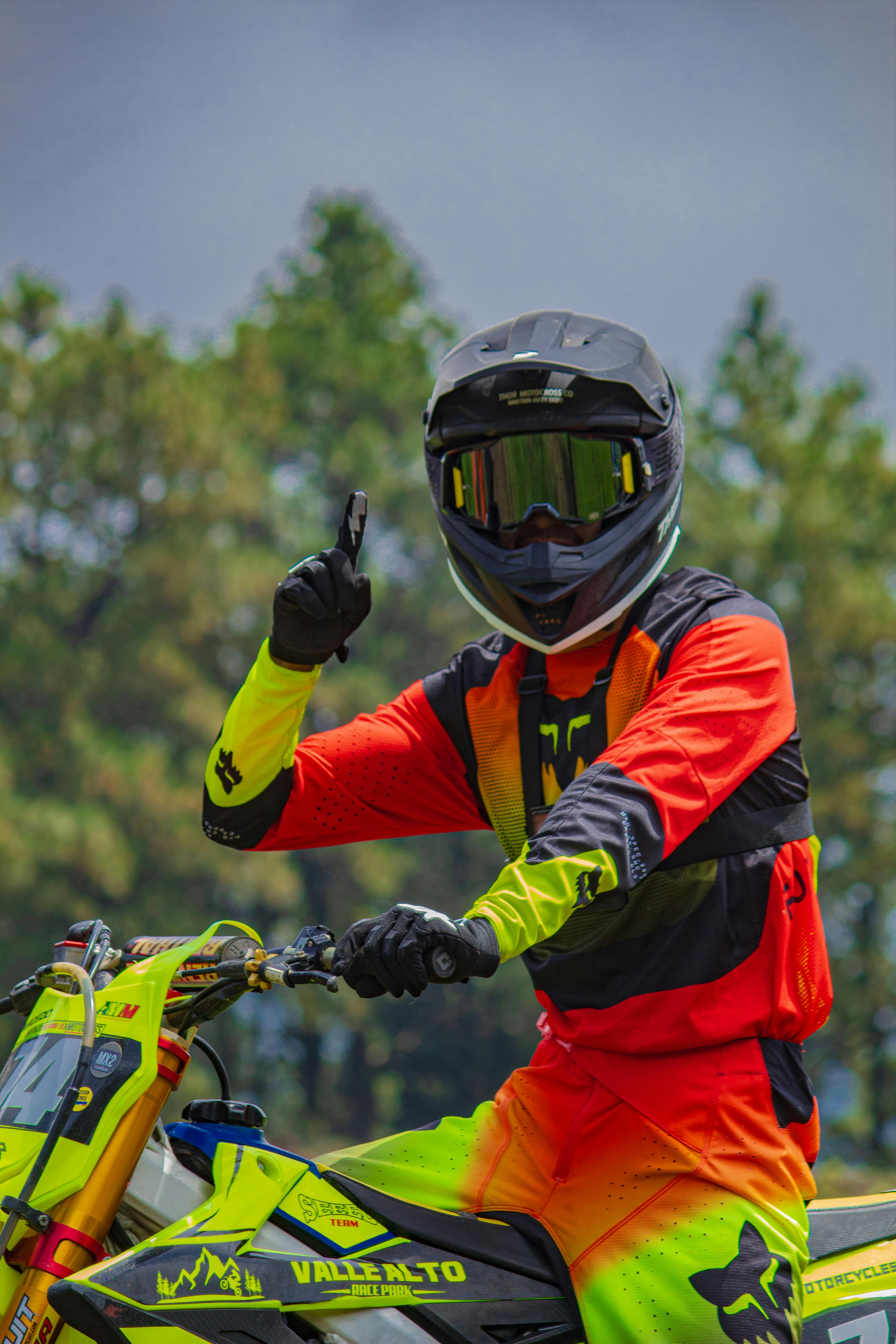 Dynamic shot of a motocross rider in vibrant gear at La Marquesa, Mexico, showcasing sports passion and adrenaline.
