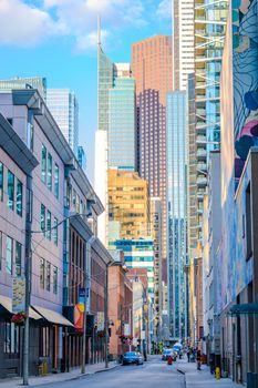 Colorful cityscape of downtown skyscrapers showcasing modern design and urban life.