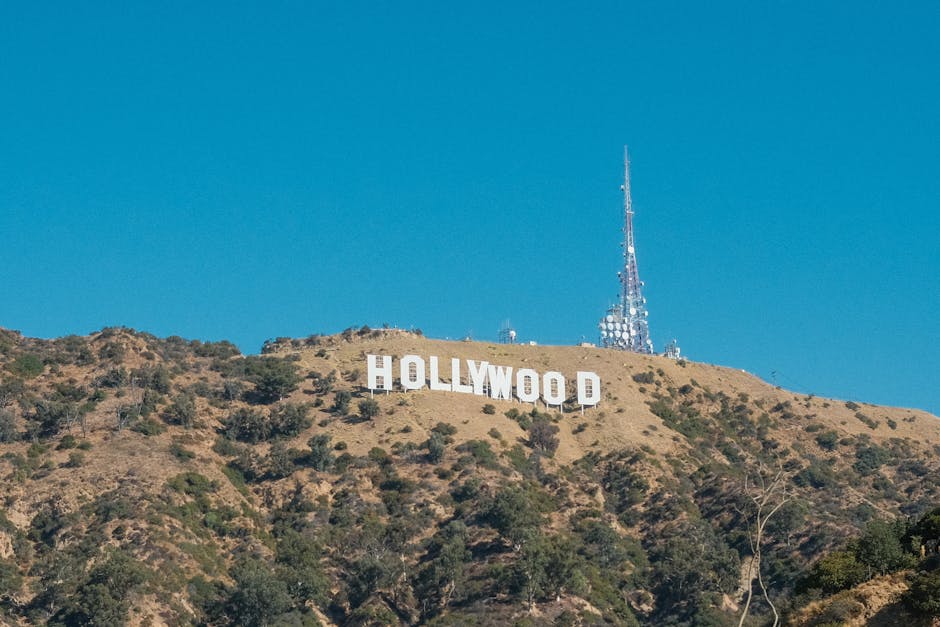 The iconic Hollywood Sign on a sunny hillside in Los Angeles, California.