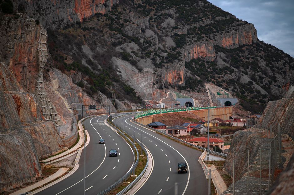 Car driving on a winding mountain road in Montenegro