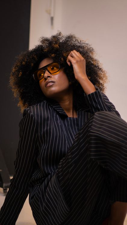 Stylish Portrait of Woman in Striped Suit · Free Stock Photo