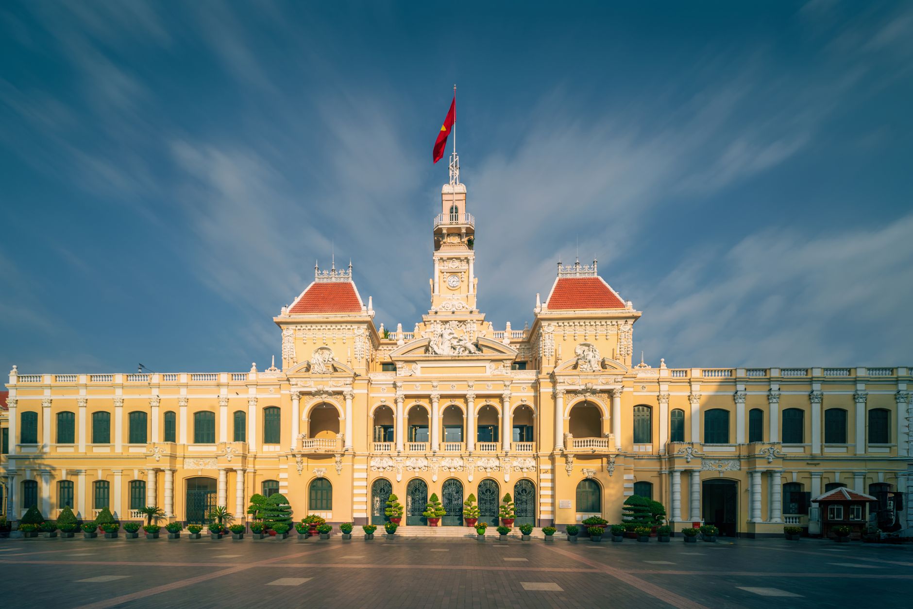 Front view of the historic Ho Chi Minh City Hall in Vietnam with a clear sky.