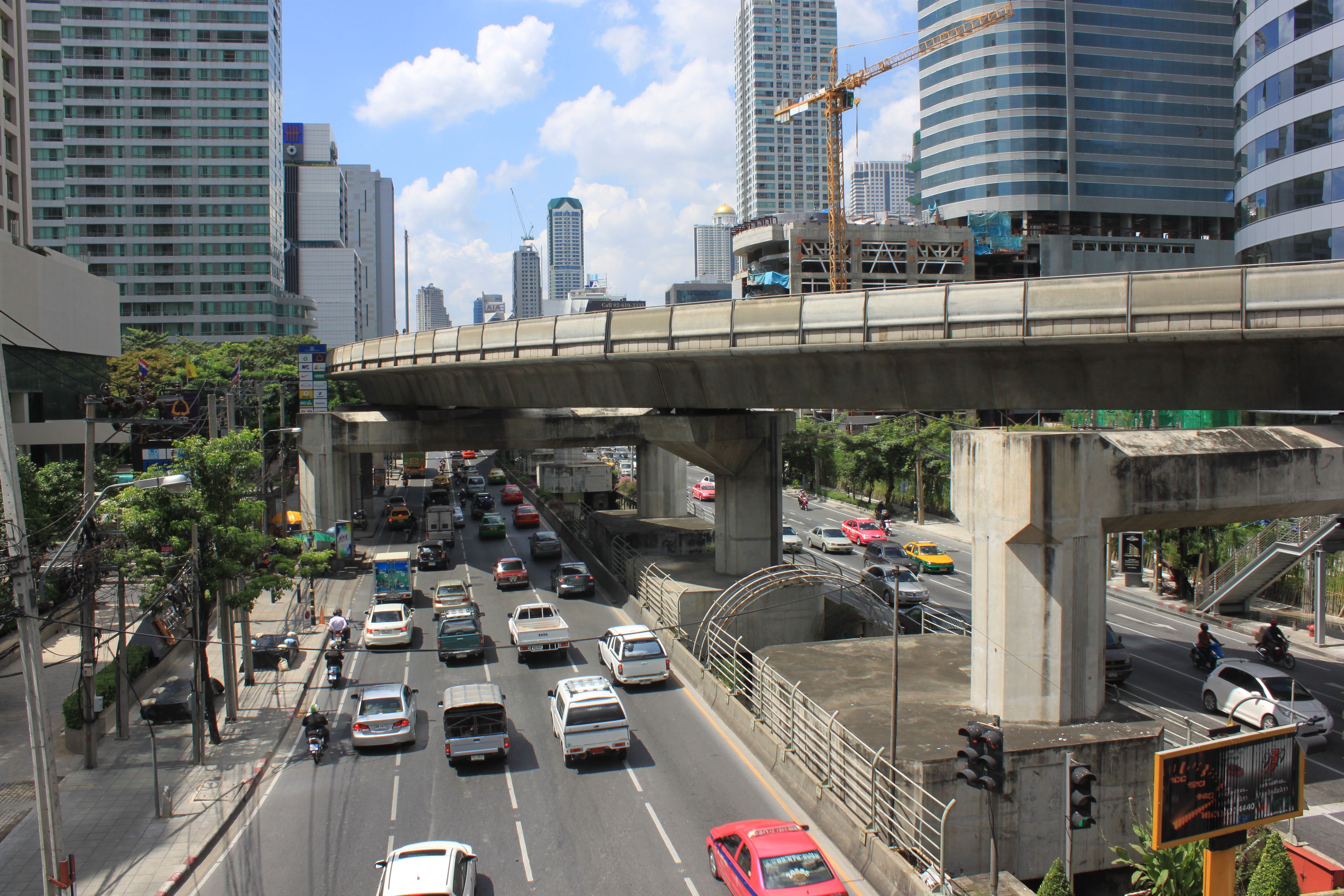 Rain sheeting off a covered Skytrain walkway in central Bangkok