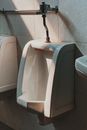 Shallow Focus Photo of White Ceramic Urinal Bowl