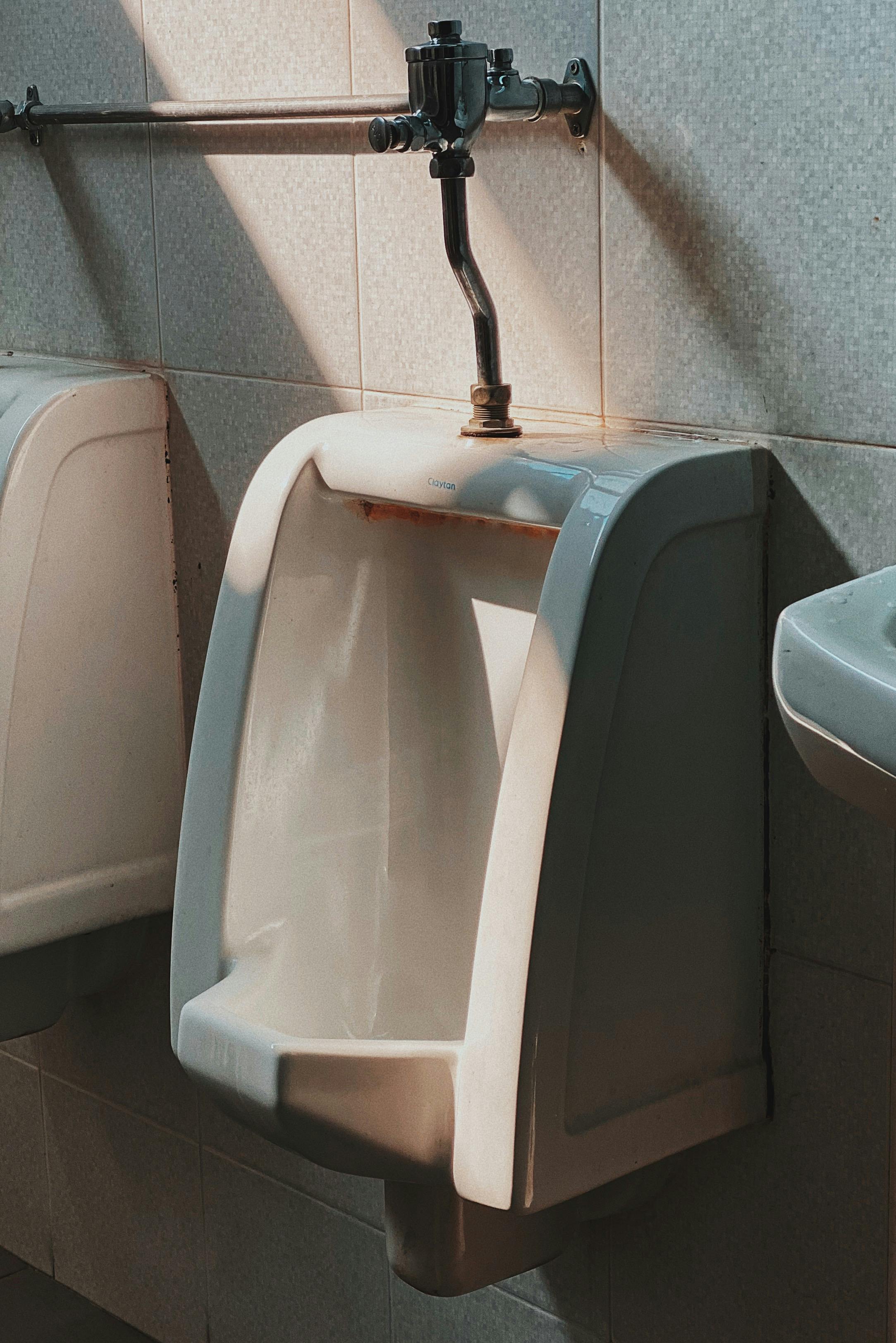 Shallow Focus Photo of White Ceramic Urinal Bowl · Free Stock Photo