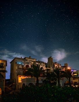 Beautiful night view of Playas de Vera with stars and unique architecture.
