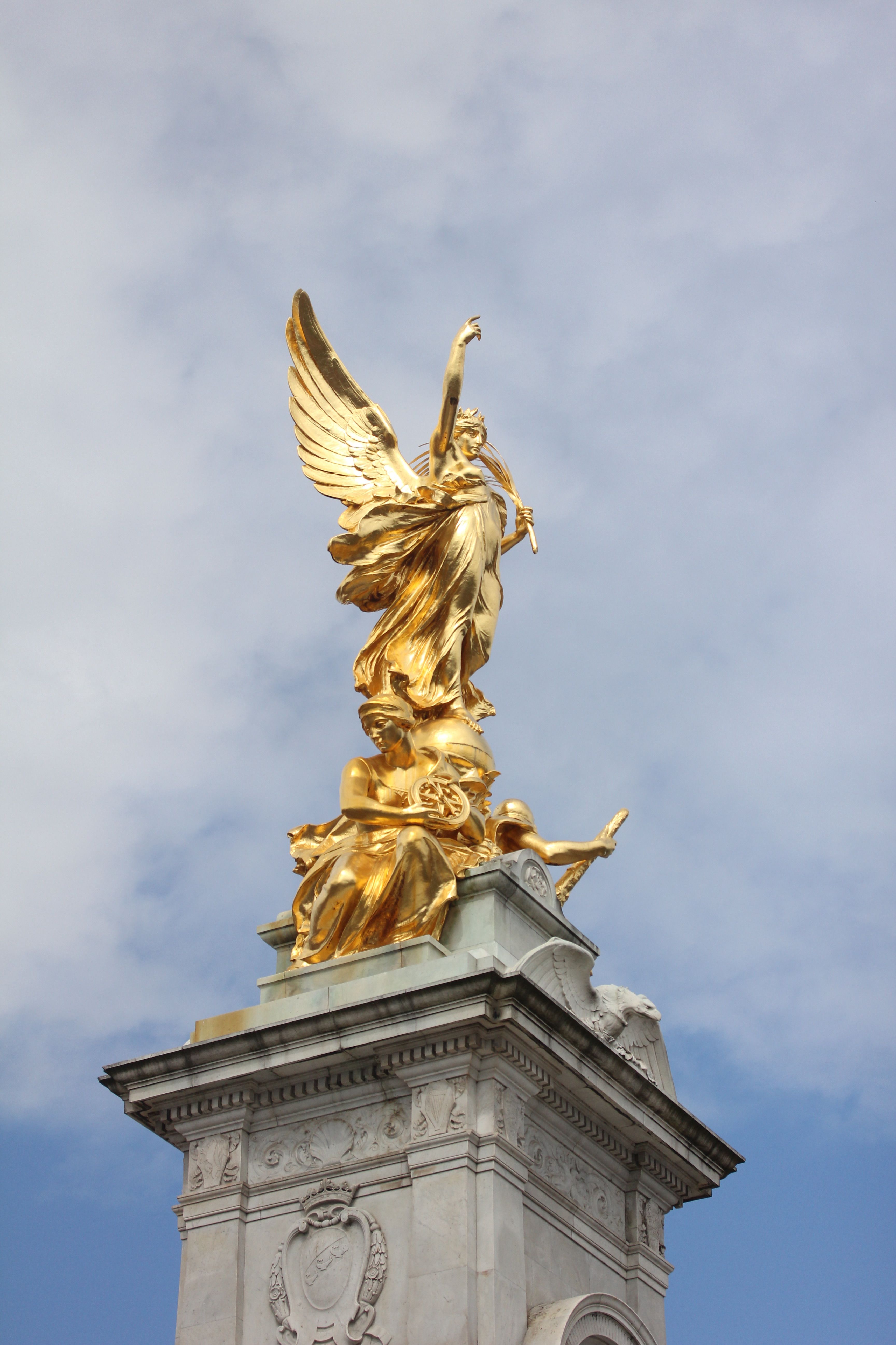 Gold Statue Under Blue Sky · Free Stock Photo